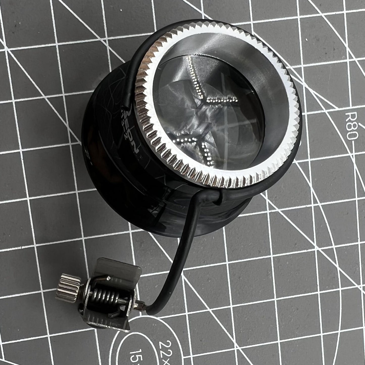 Swiss Bergeon clip-on eyeglass with precision magnification for detailed watch repair tasks