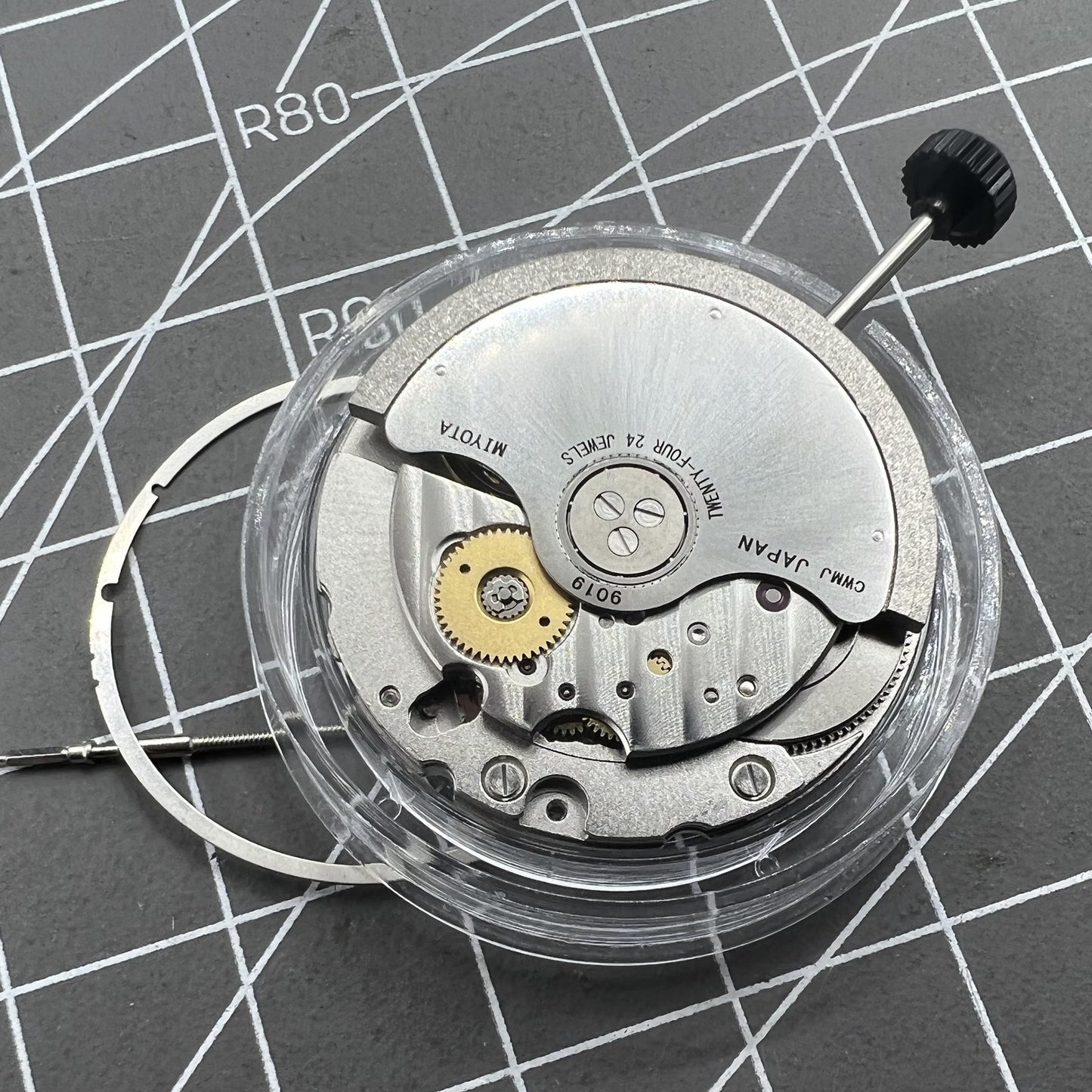 Miyota 9019 automatic watch movement with mechanical date display at 6 o'clock, precision Japanese brand.