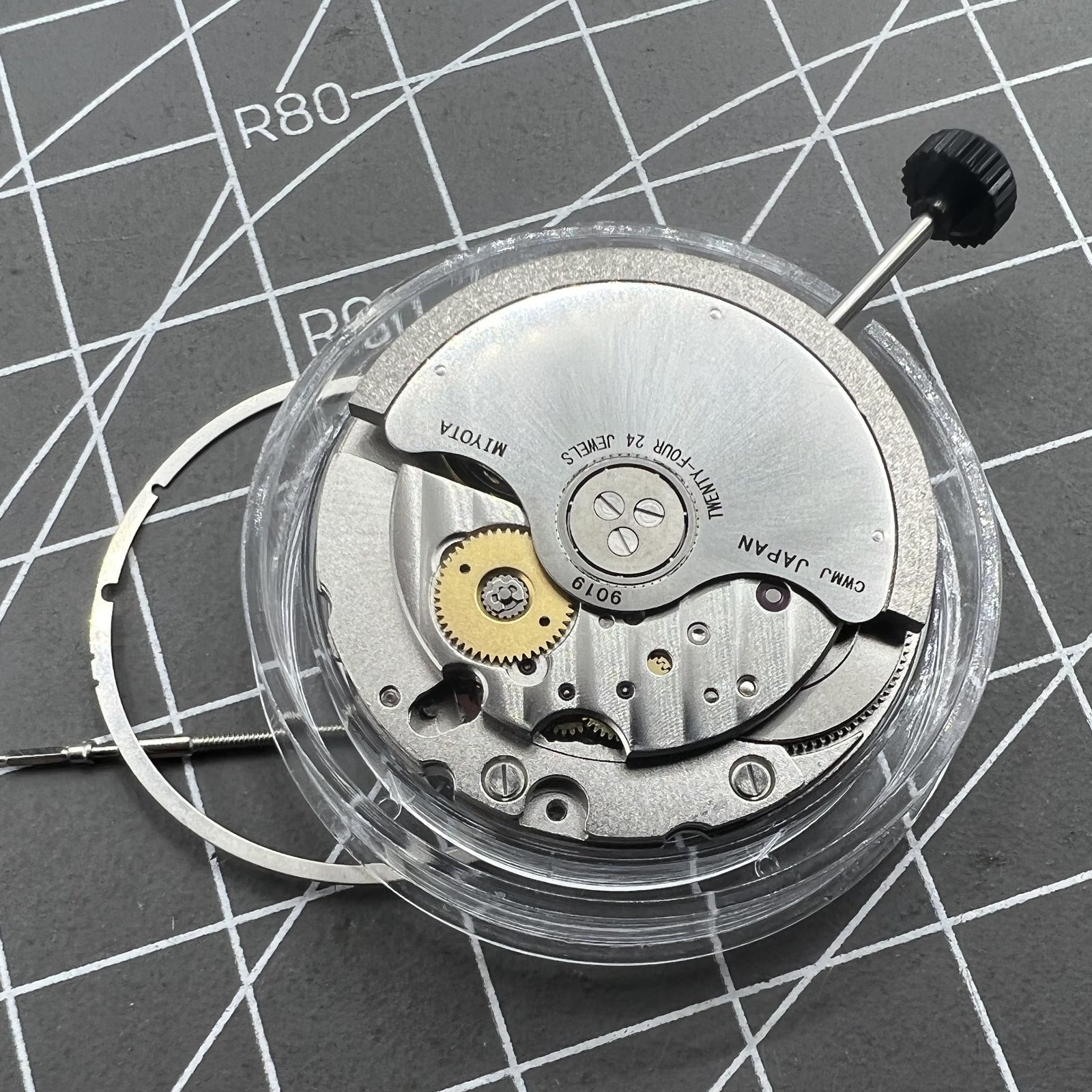 Miyota 9019 automatic watch movement with mechanical date display at 6 o'clock, precision Japanese brand.