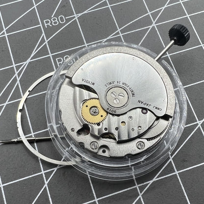 Miyota 9019 automatic watch movement with mechanical date display at 6 o'clock, precision Japanese brand.