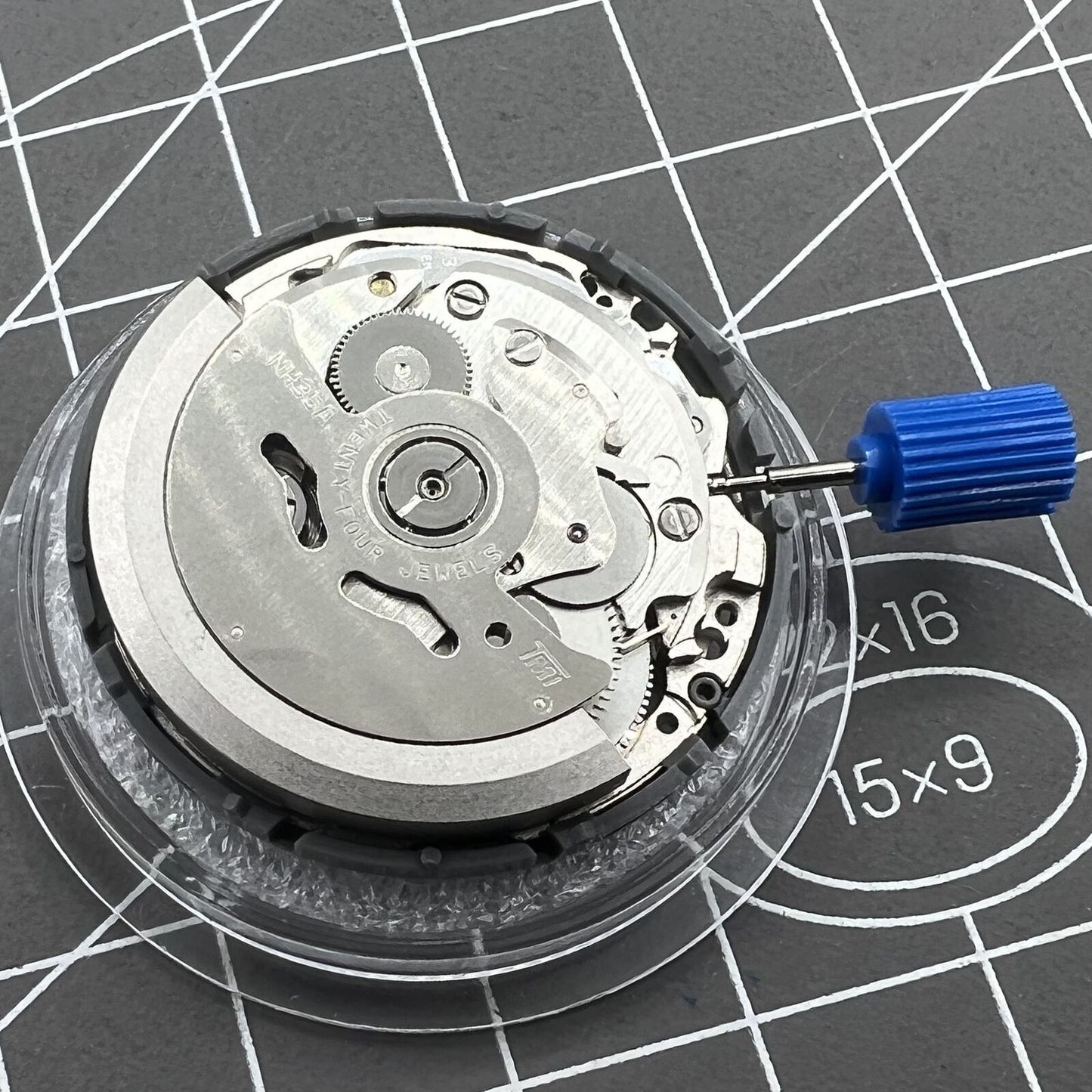 Seiko Black NH35 automatic watch movement with date at 6, precise self-winding mechanical mechanism.