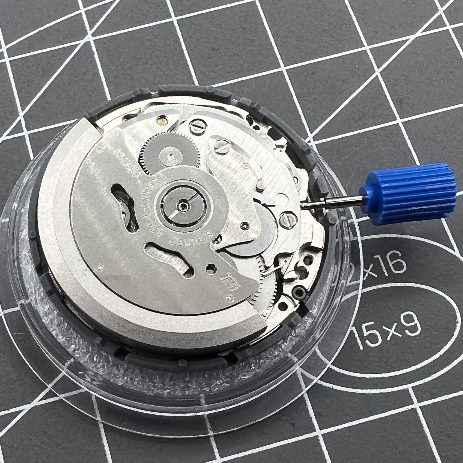 Seiko Black NH35 automatic watch movement with date at 6, precise self-winding mechanical mechanism.