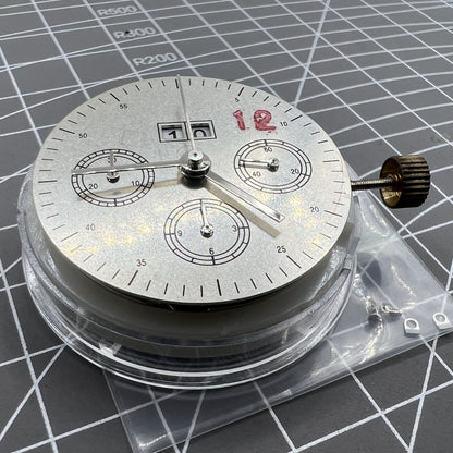 7750 mechanical watch movement showing big date at 12 and small second at 3, detailed close-up