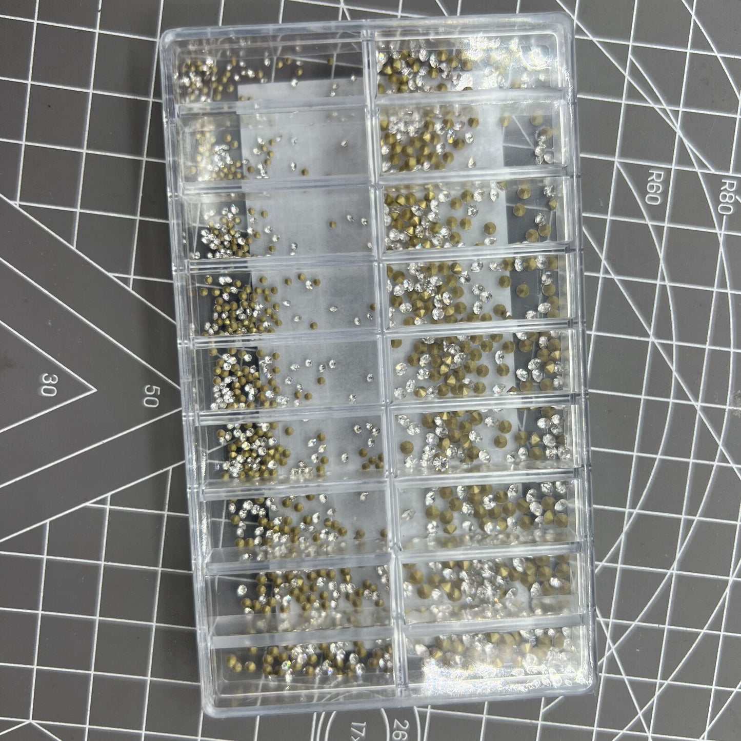 Box of 18 pointed bottom imitation diamonds for watch accessory decoration and DIY crafts.
