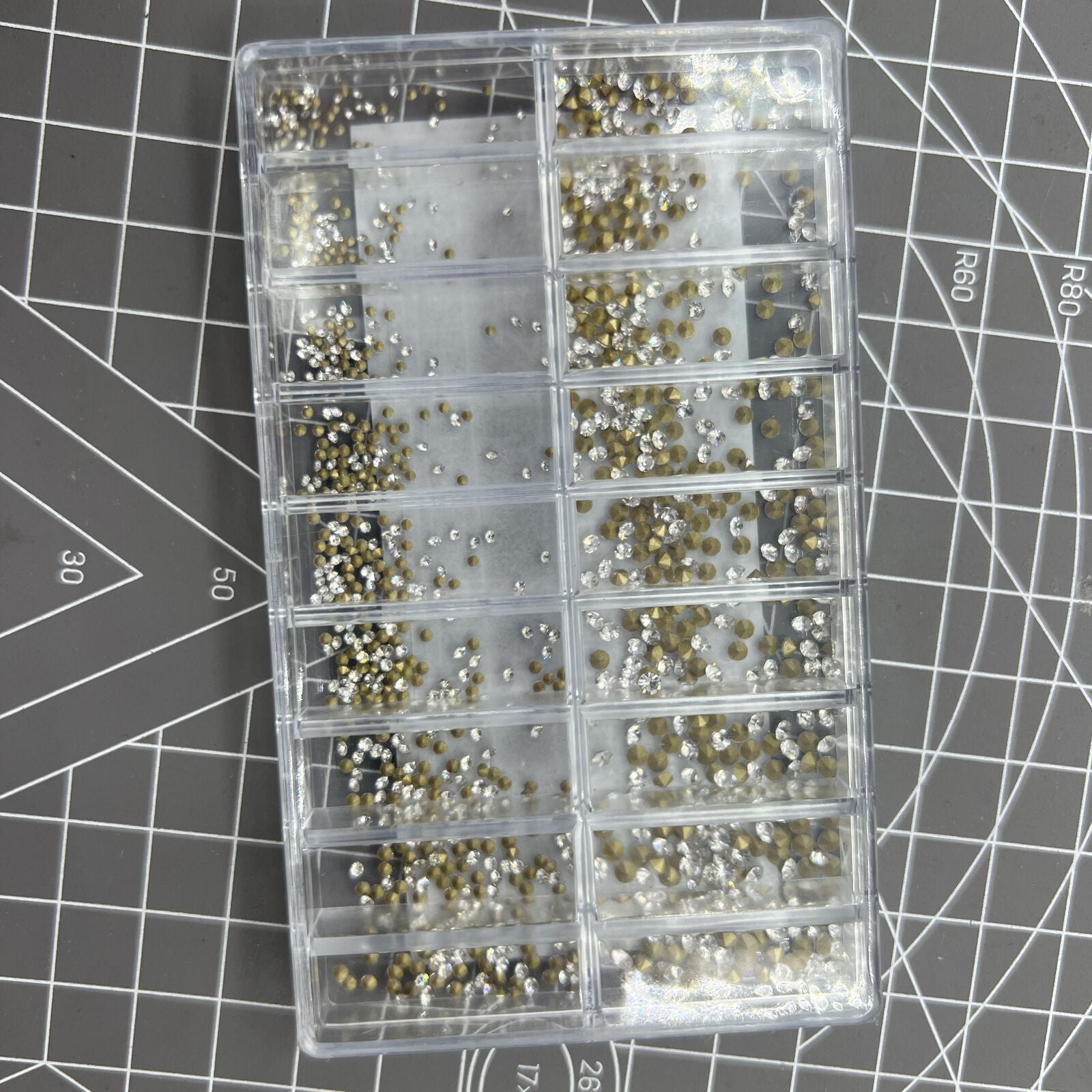 Box of 18 pointed bottom imitation diamonds for watch accessory decoration and DIY crafts.
