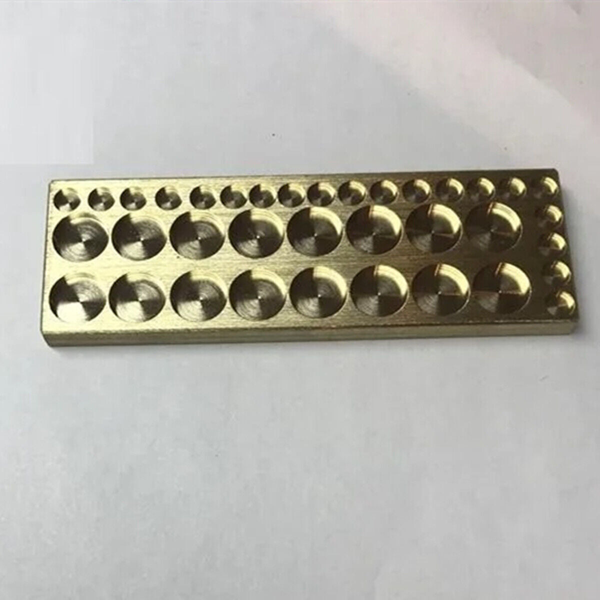 Copper golden 36-round grid storage tray for organizing screws in watch repair kits.
