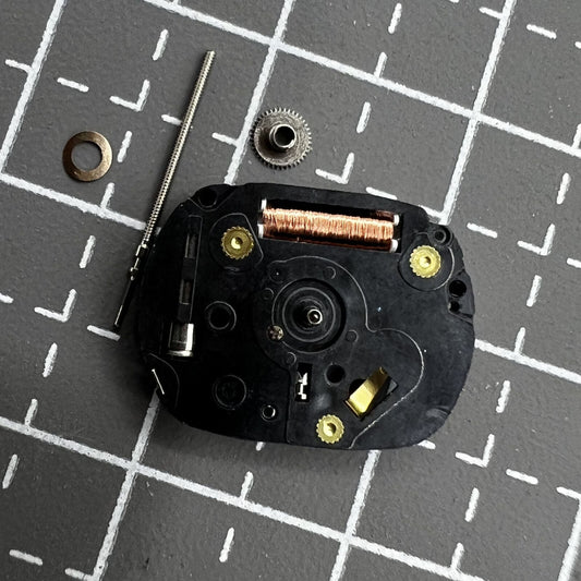 Hattori VX01 quartz watch movement with three hands, precision timekeeping for watch repair.