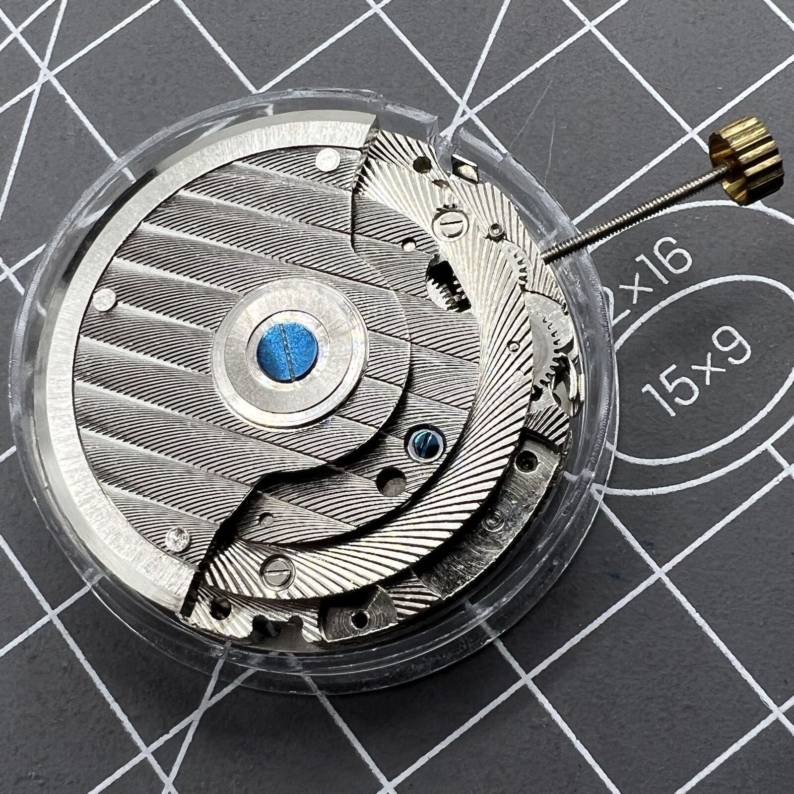 Automatic mechanical watch, reversed balance wheel, big date at 12, precision timepiece.