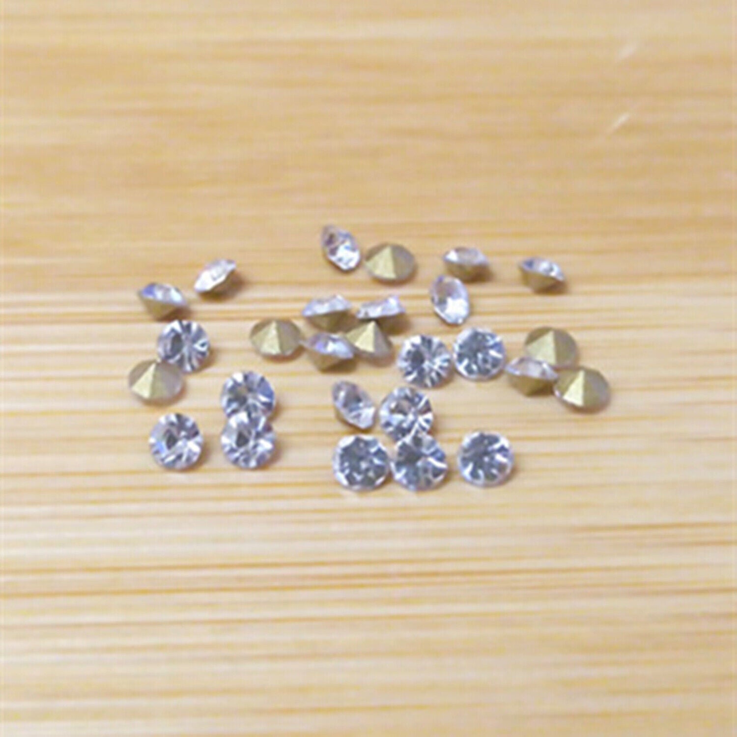 Assorted 18 sizes imitation diamond watch repair patches, pointed bottom for precise replacement.