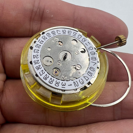 DG2813 automatic mechanical watch movement displaying three hands and date; reliable replacement part.
