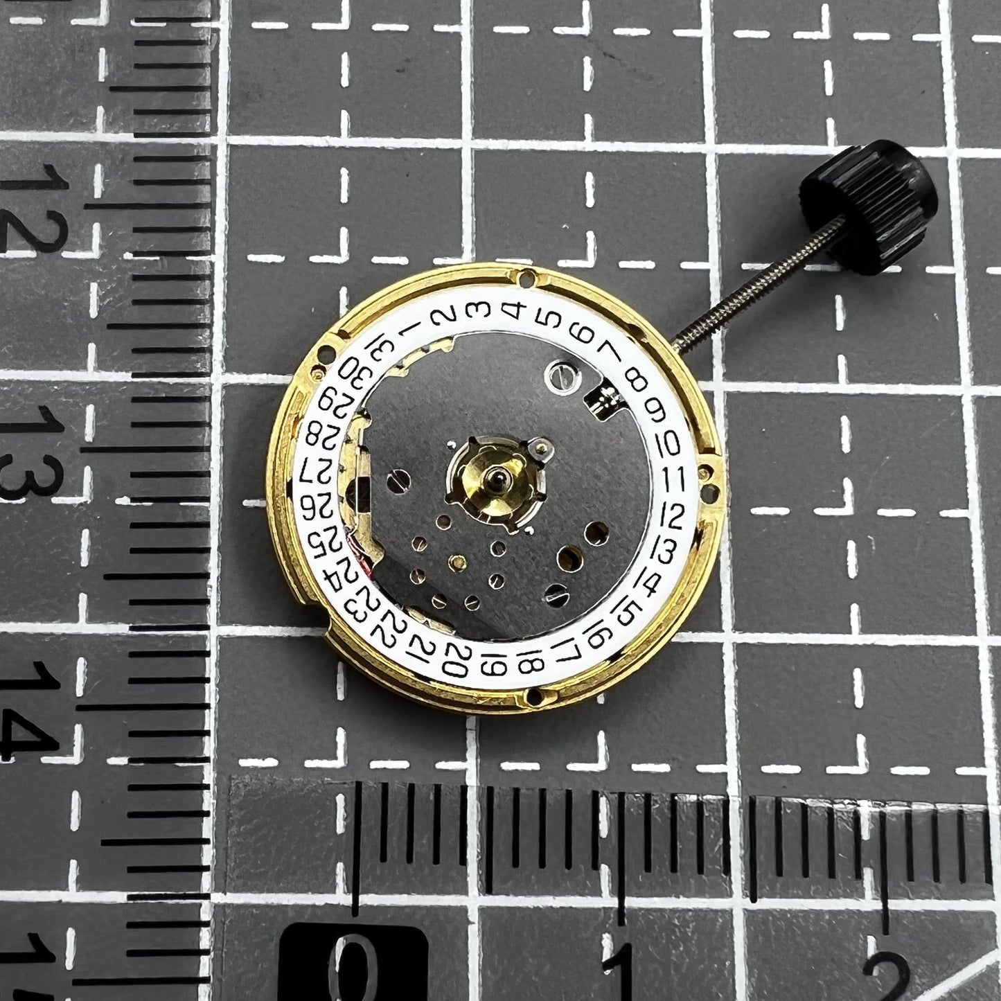 ETA F03.115 quartz watch movement with 3 hands and date at 3 o'clock, precision timing component.