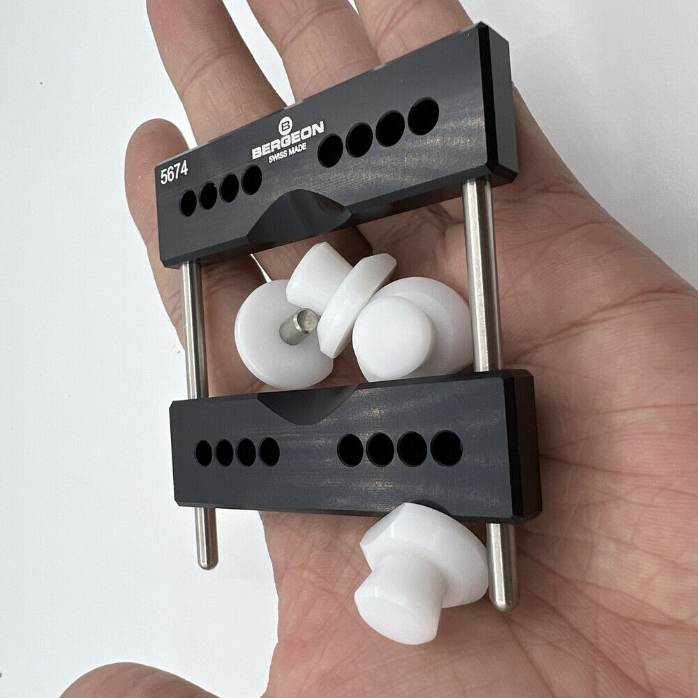 Bergeon 5674 vise jaws holding watch case firmly with 5700-Z tool for accurate repair and assembly.