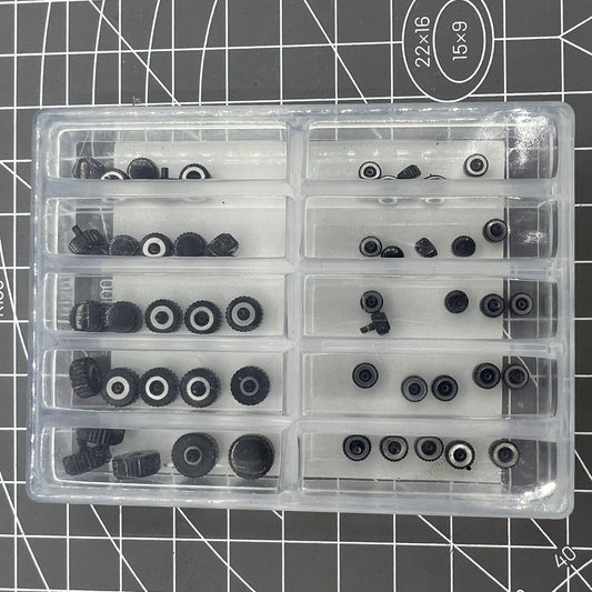 Assortment of 50 black waterproof stainless steel watch crowns for watch repairs.