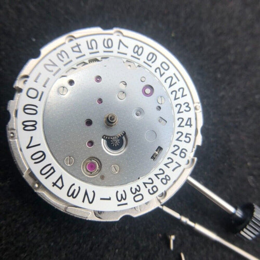 Miyota Citizen 9015 automatic watch movement showing date feature at 3 and 6 o?clock positions.