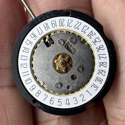 Ronda 585 Swiss quartz watch movement with date display at 6 o'clock, standard height design.