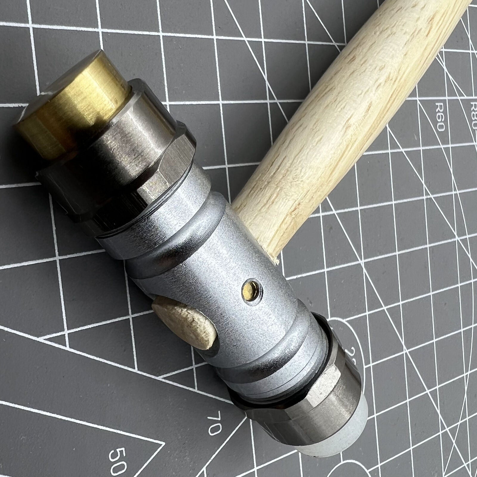 Swiss Bergeon 30417 hammer with brass and synthetic ends, designed for precise watch accessory repairs.