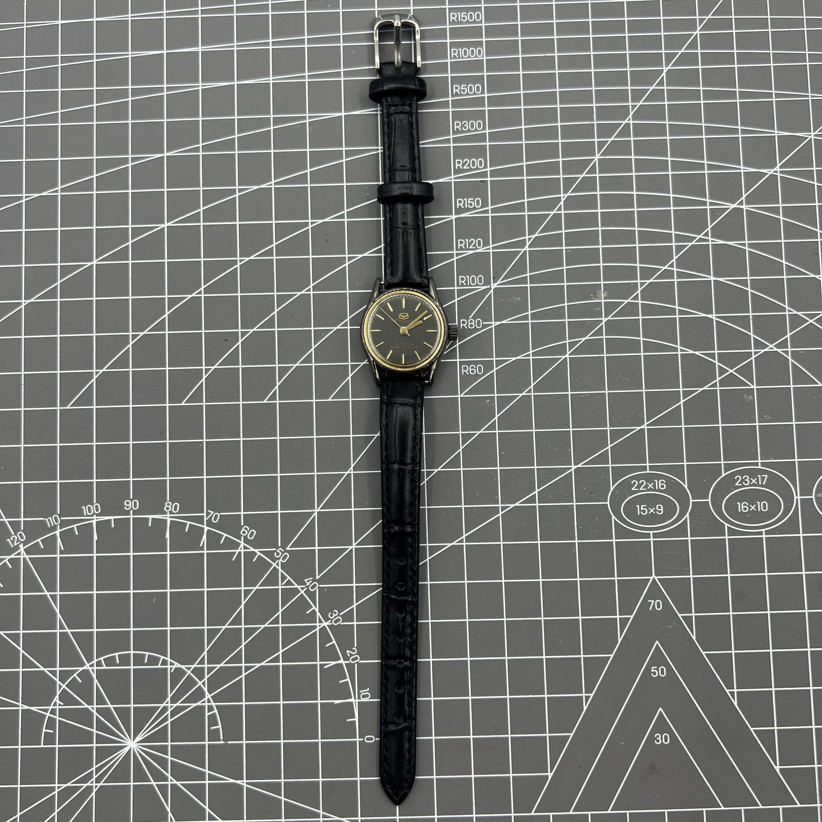 Black case ladies Seagull manual mechanical watch with golden nail markers, shock-resistant design for durability.