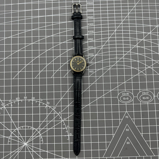 Black case ladies Seagull manual mechanical watch with golden nail markers, shock-resistant design for durability.