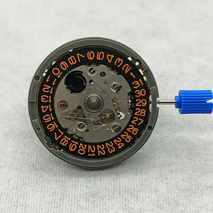 NH35 automatic watch movement with black dial, orange numerals, date display, and side crown.