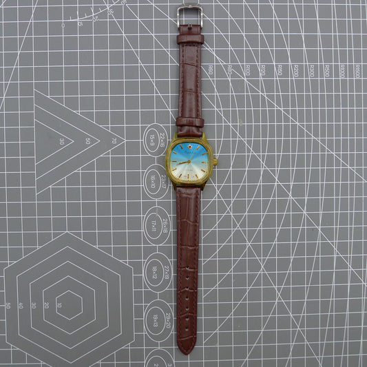 Shanghai brand 33mm manual mechanical watch with blue dial, golden nail markers, and square case, 17 jewels movement.