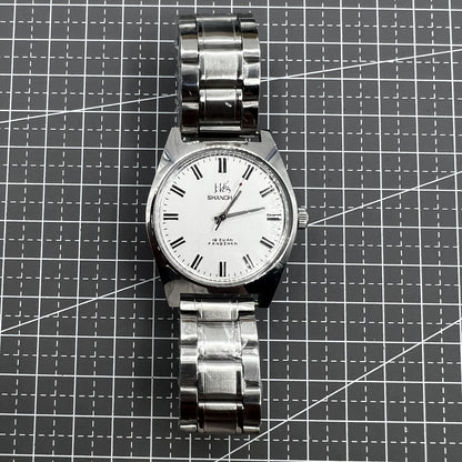 Shanghai 38mm manual mechanical watch with white dial, three hands, and stainless steel case by Shanghai brand.