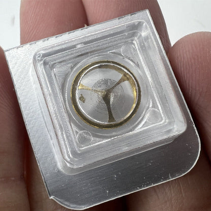 Golden balance wheel with hairspring for Orient 46941 46943 watch, ensuring precise timekeeping accuracy.