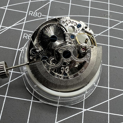 Carved Silver Hollow 7120 automatic watch with intricate mechanical movement and elegant design.