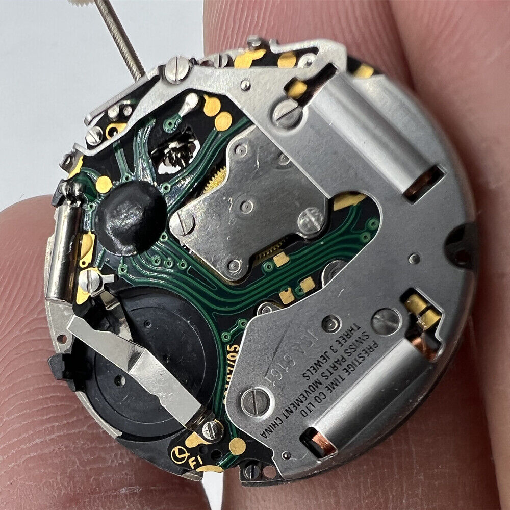 Swiss ISA 8161 silver quartz watch movement with date at 4, perfect for watch repair and replacement.