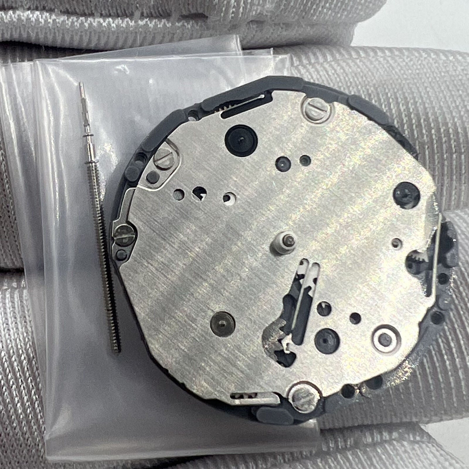 Japan Made Hattori Epson TMI VD87 quartz watch movement showing precise internal components and craftsmanship.