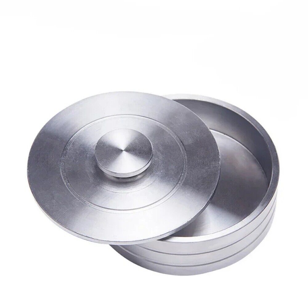 Steel and copper watch oil cylinder for precise watch repair and maintenance.