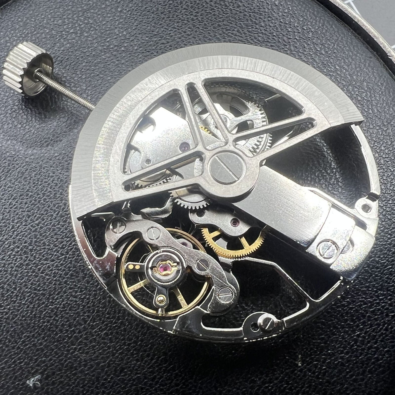 Dandong 8306 silver watch with hollow dial showcasing 2-hand automatic movement, elegant style for formal wear.