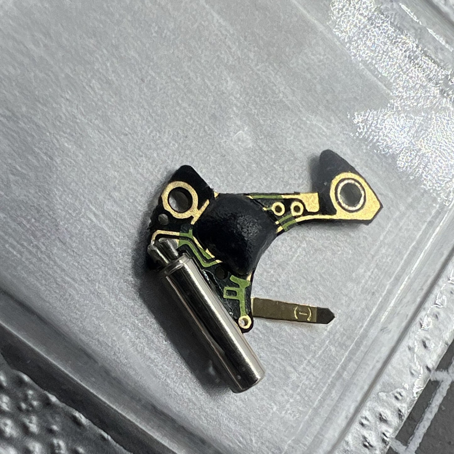 Circuit board for Ronda 1042 watch movement, precise fit for reliable timekeeping.