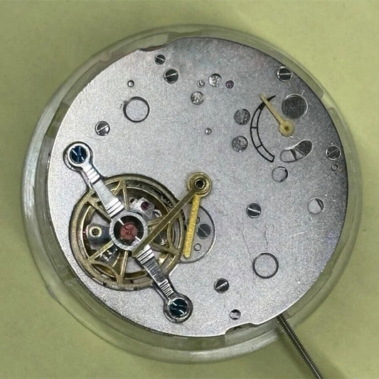 Shanghai brand watch accessory featuring mechanical movement with bare balance wheel and 6 o'clock flywheel detail.