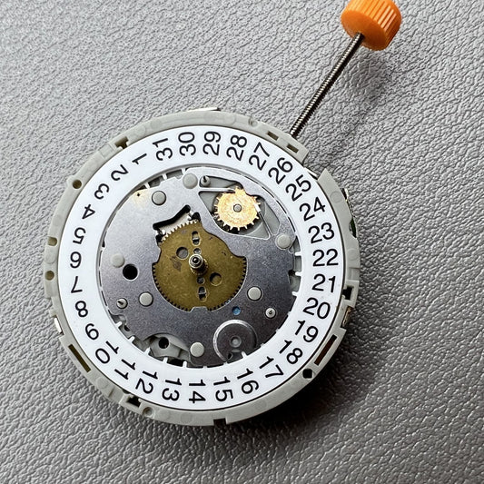 M921 Quartz watch with 3 eye subdials and small second hands at 2, 6, 10 o?clock positions.