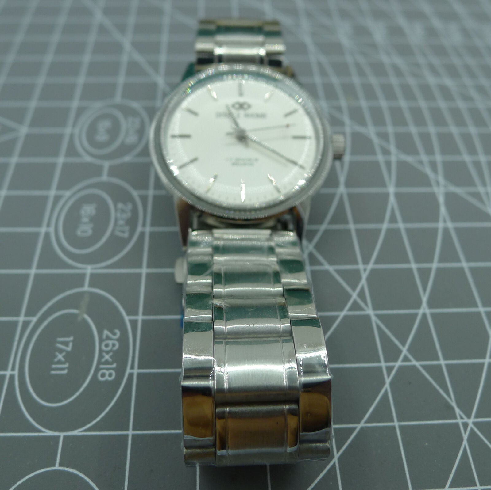 Beijing 36mm manual watch with silver case, nail-shaped markers, classic style for elegant wristwear.