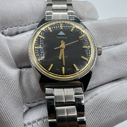 Chinese Taihang 32mm manual watch with black dial, golden markers, and 17 jewels precision movement for classic style.