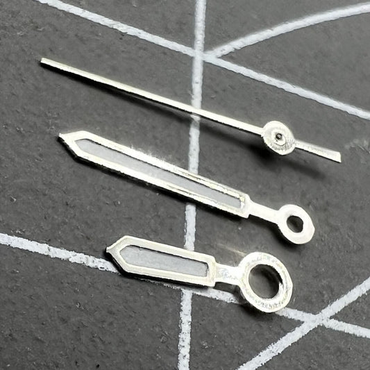 9.5mm white-trimmed green lume watch hands by Miyota for 1L12 Japan quartz movement precision.