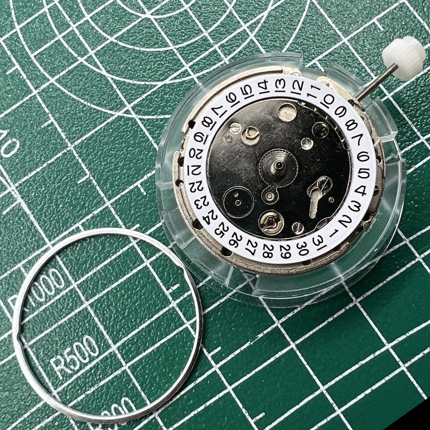 Mingzhu DG2813 silver automatic watch movement with three hands, ideal for watch accessory replacements.
