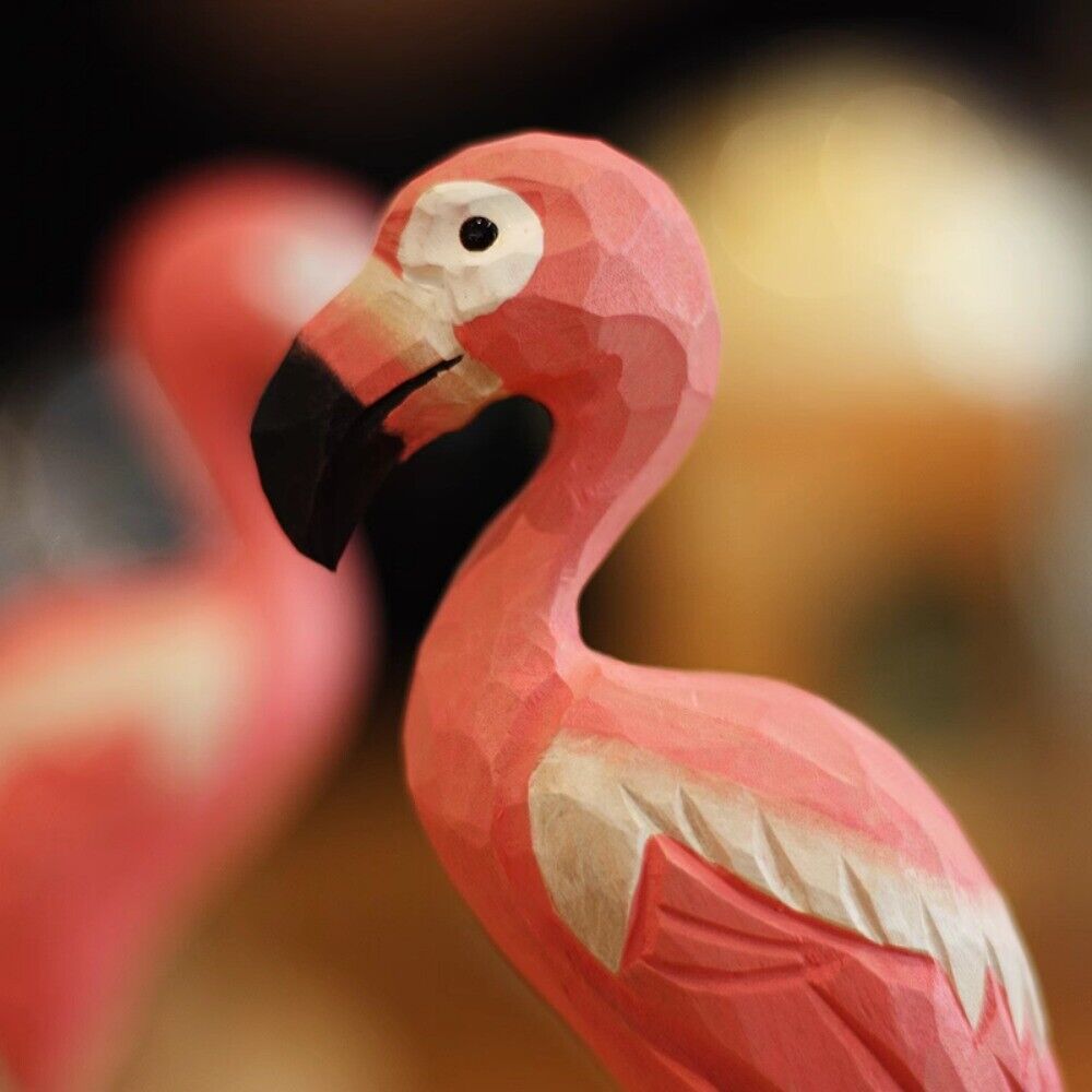 Handcrafted pink flamingo wooden figurine, perfect decorative artwork for home or office.