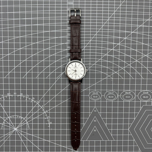 China Baihua 37mm manual mechanical watch with silver dial, 19 jewels, and shock-resistant design.