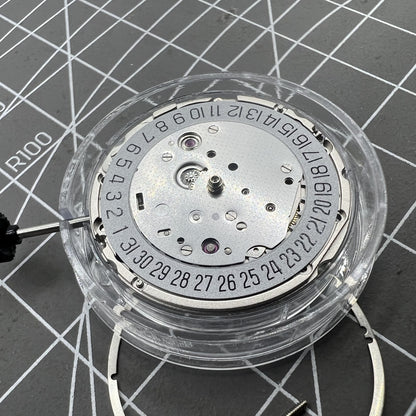 Miyota 9019 automatic watch movement with mechanical date display at 6 o'clock, precision Japanese brand.
