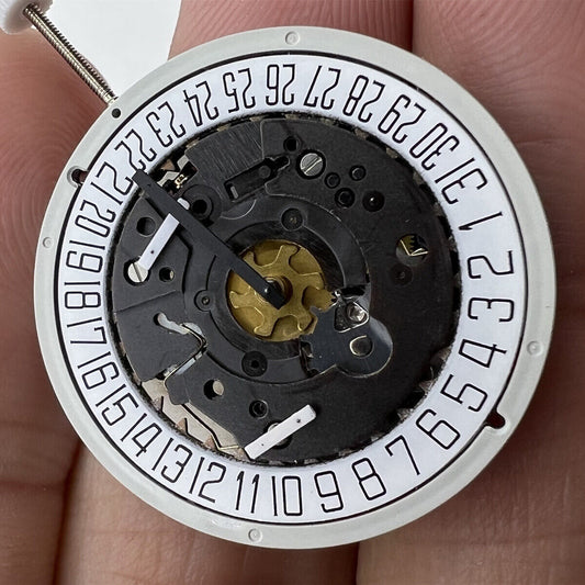 1. ISA 8172 Date At 6 quartz watch movement by ISA, precise timekeeping for repair.  