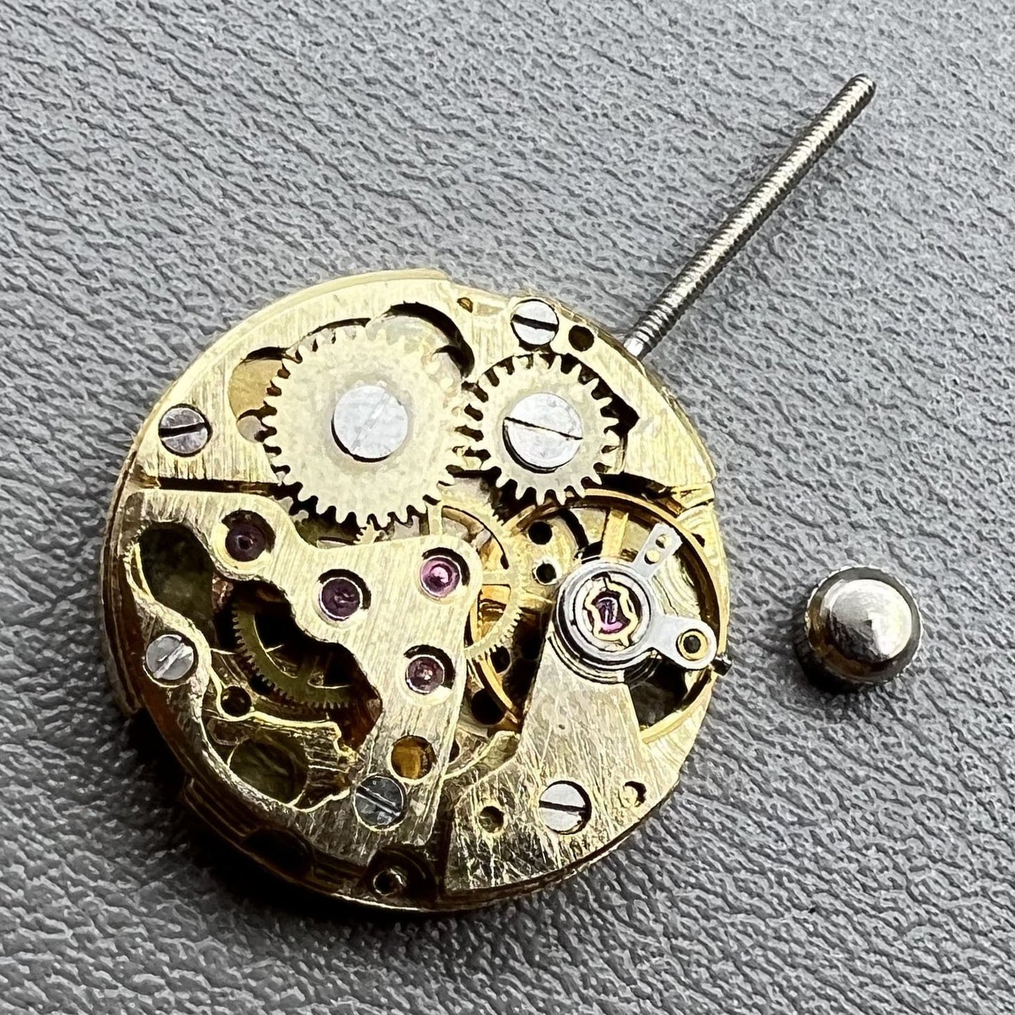 Set of 2 golden 17.2mm hollow mechanical movement cufflink parts for watchmaking.