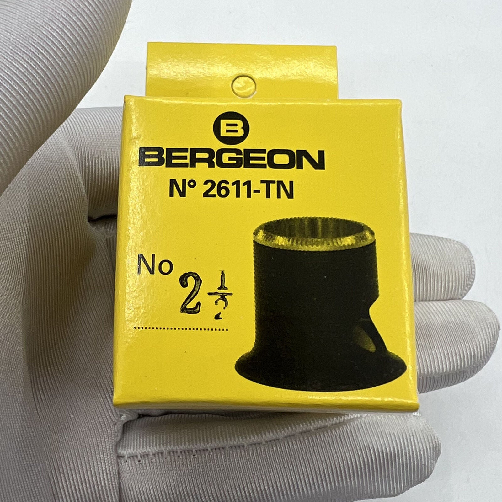 Swiss Bergeon 2611-TN-2.5 loupe featuring 4x magnification for precise watch inspection and repair tasks.
