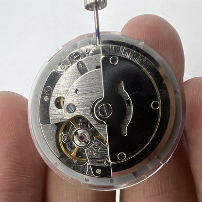 Asian Tianjin Seagull T16 watch with golden dial, day-date display, and automatic mechanical movement