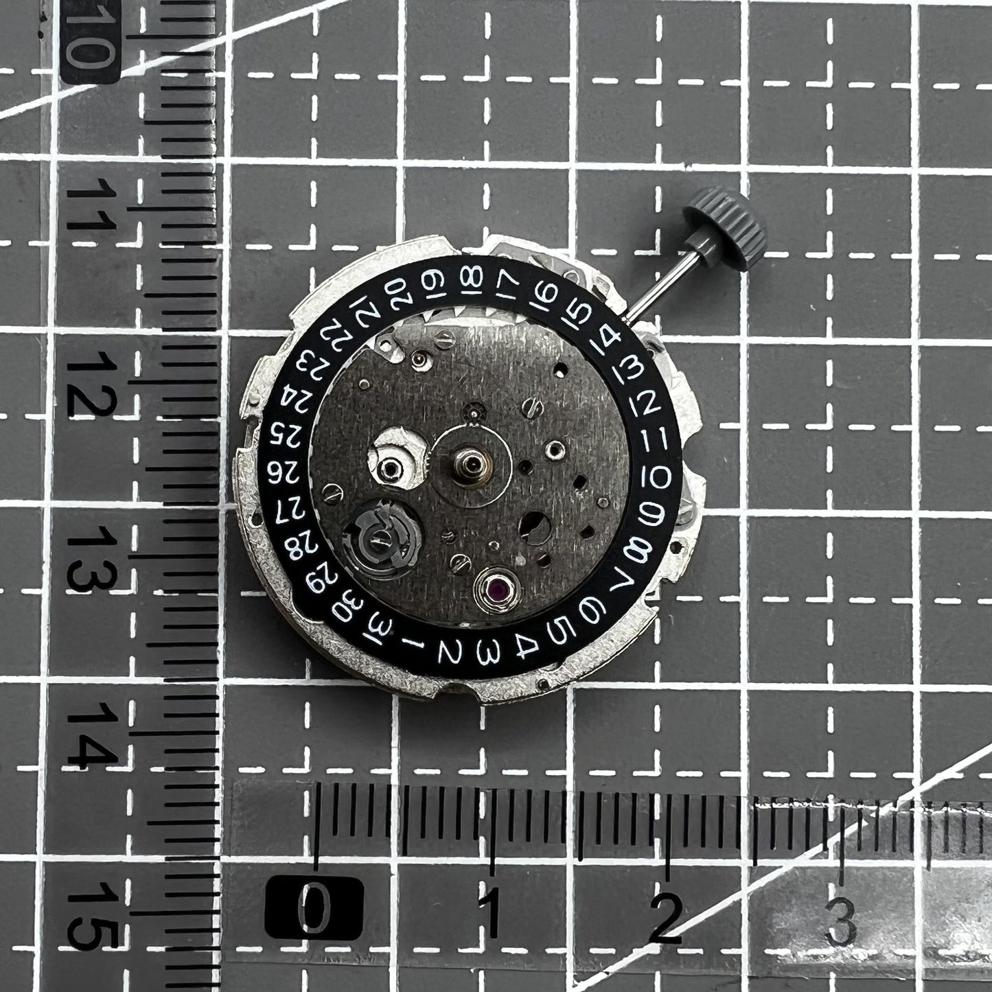 Citizen Miyota 8215 automatic mechanical watch movement with black dial and date display at 3 o'clock.