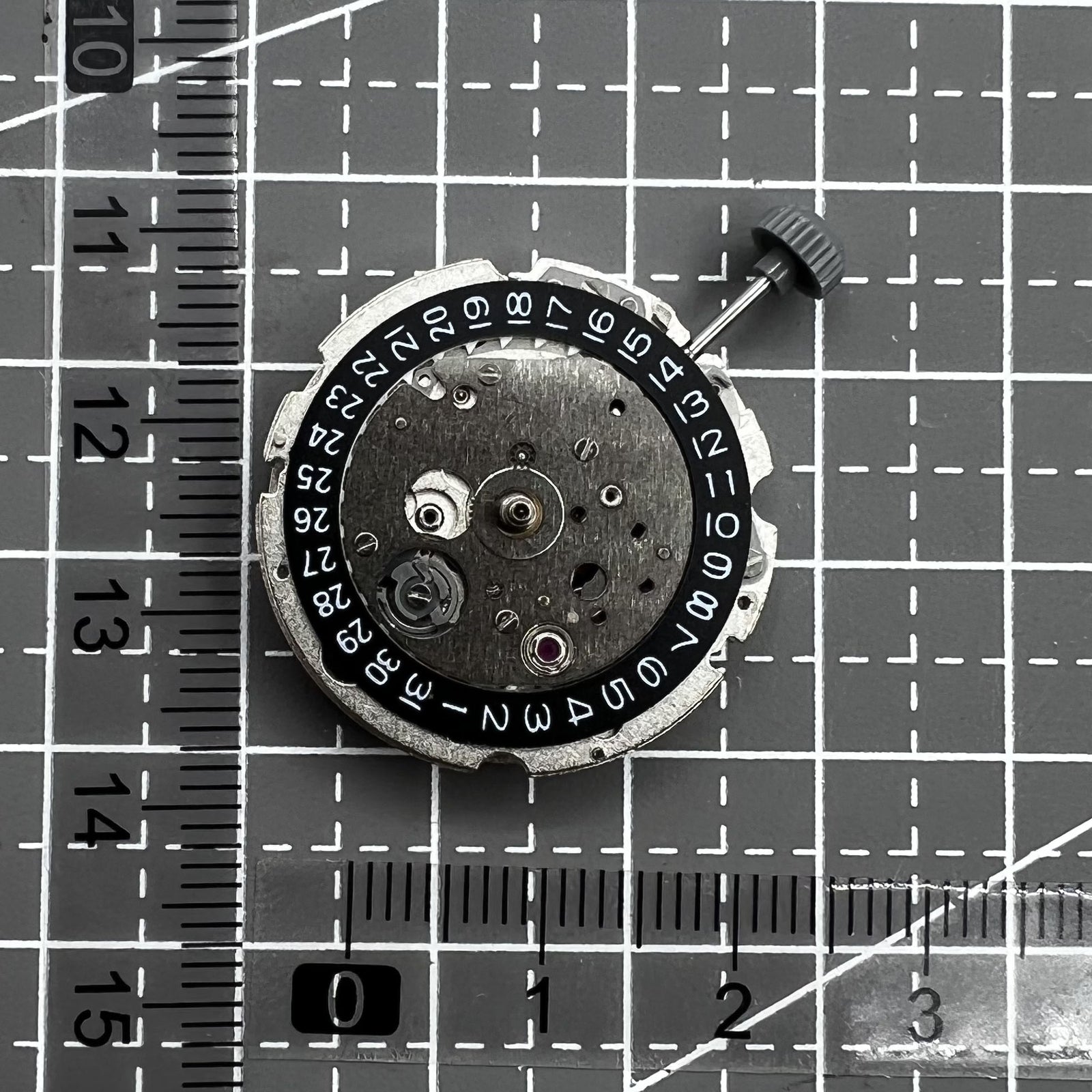 Citizen Miyota 8215 automatic mechanical watch movement with black dial and date display at 3 o'clock.