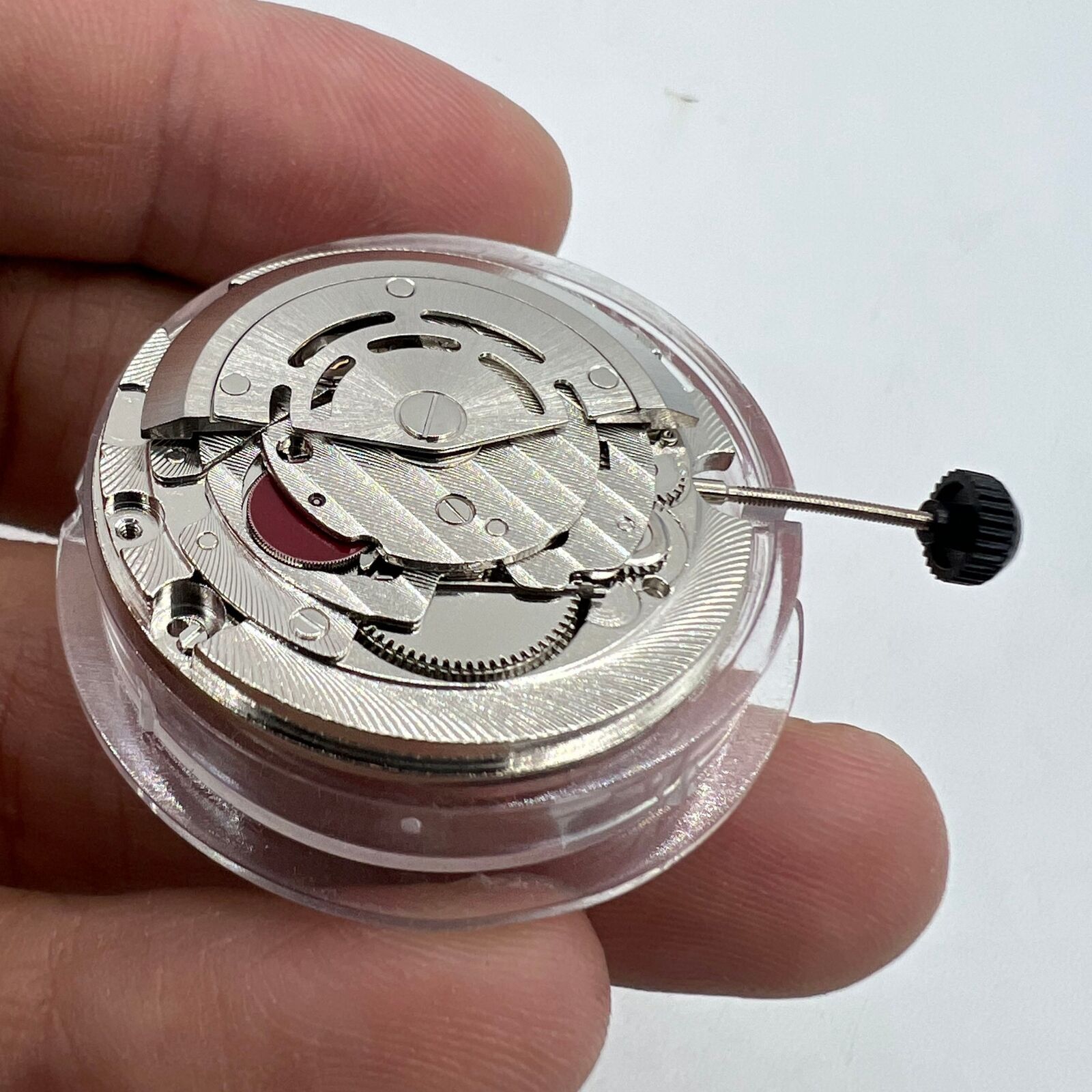 ST2147 automatic mechanical watch with day at 12 o'clock and date at 3 o'clock.