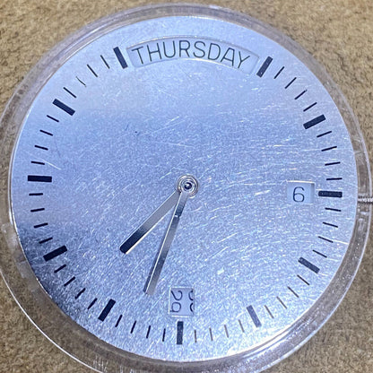 1. China Made 2834-2 automatic mechanical watch movement in silver and gold tones.  