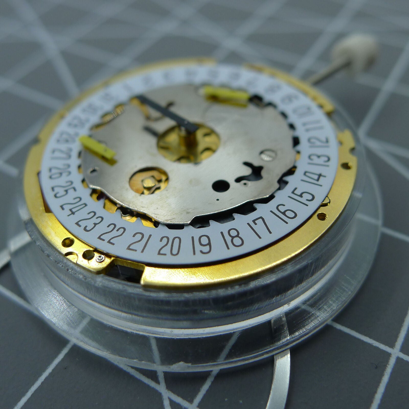 Swiss Made ISA 8171 quartz watch movement with date display at 6, multifunctional and precise mechanism.